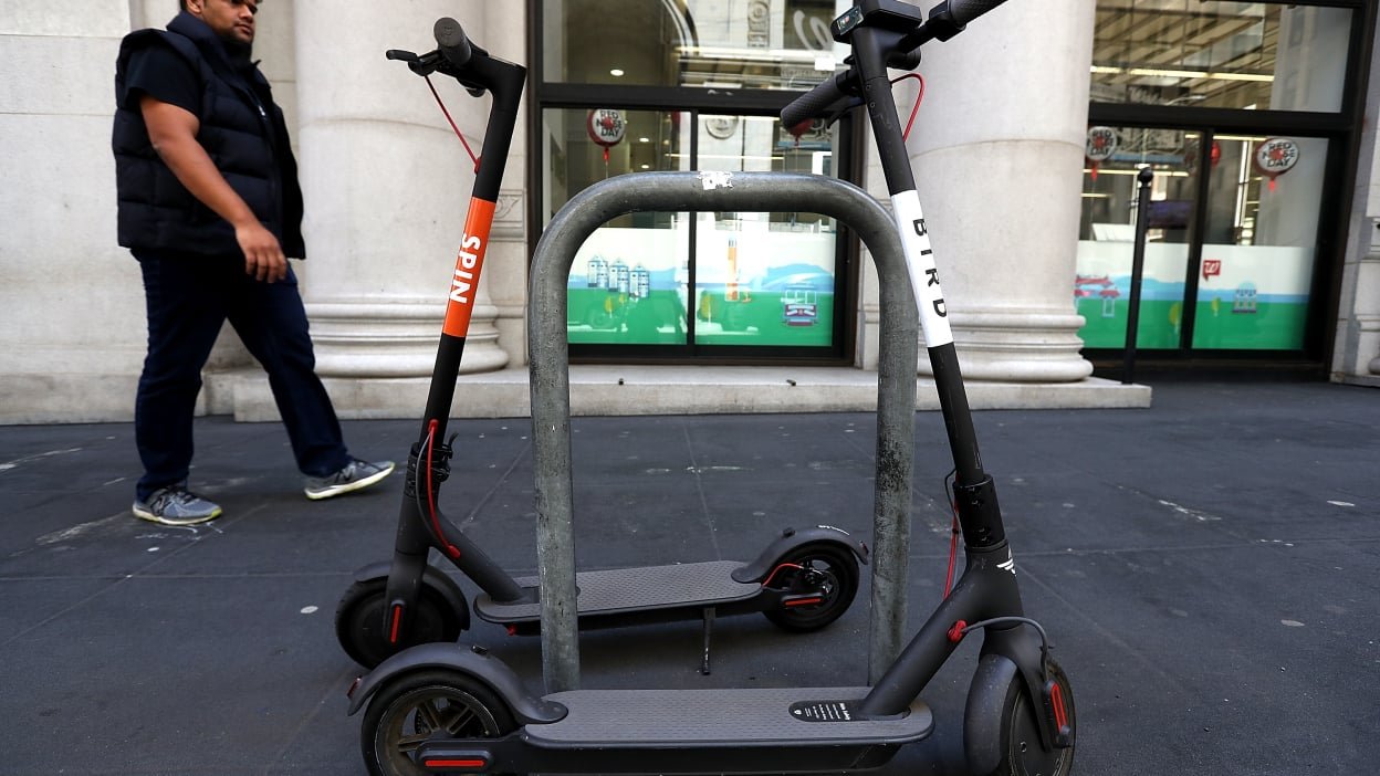 Cities scramble to contain the flood of e-scooters